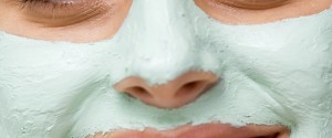 Smiling woman with facial mask