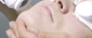 Woman undergoing laser skin treatment